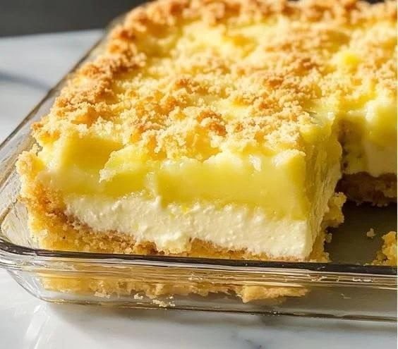 Lemon Cream Cheese Dump Cake served on a plate with a fork
