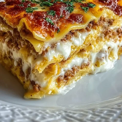 Delicious breakfast lasagna layered with eggs, cheese, and savory meats