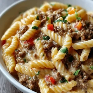 Creamy Rotel pasta with ground beef in a bowl, ready for dinner.
