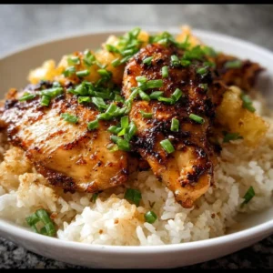 Delicious Hawaiian Chicken served with coconut rice in a vibrant presentation.