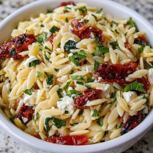 Homemade orzo pasta salad with feta cheese and sun-dried tomatoes