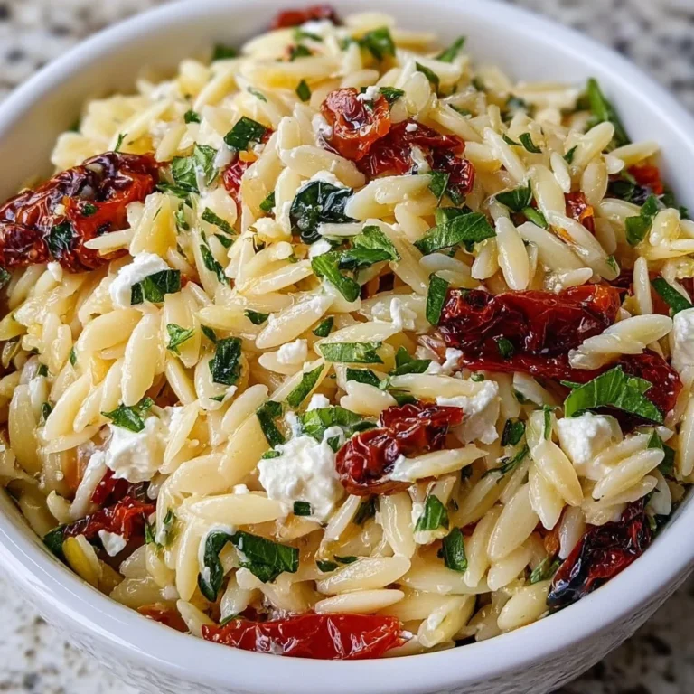 Homemade orzo pasta salad with feta cheese and sun-dried tomatoes