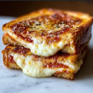 Mouthwatering Pizza Grilled Cheese sandwich with gooey cheese and pizza toppings