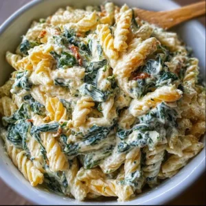 Delicious bowl of spinach dip pasta salad with fresh ingredients